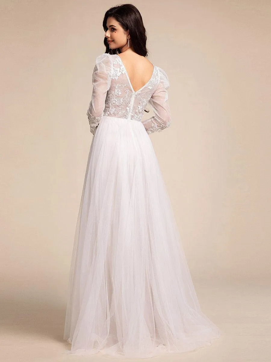 Robe de mariée transparente à col en V et manches gigot