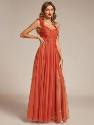 Robe de soirée asymétrique en tulle à appliqués et fente haute