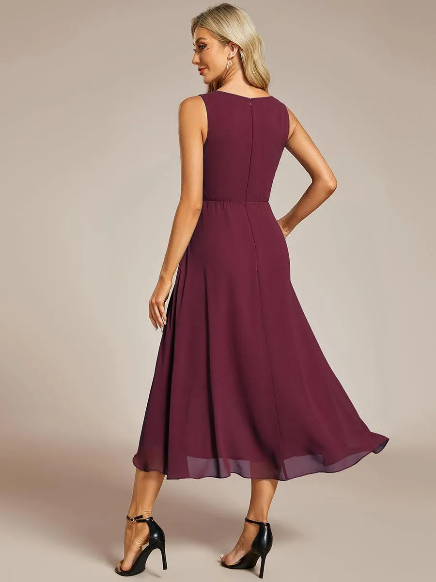 Robe d'invité de mariage haute-basse en mousseline de soie sans manches avec applique à la taille